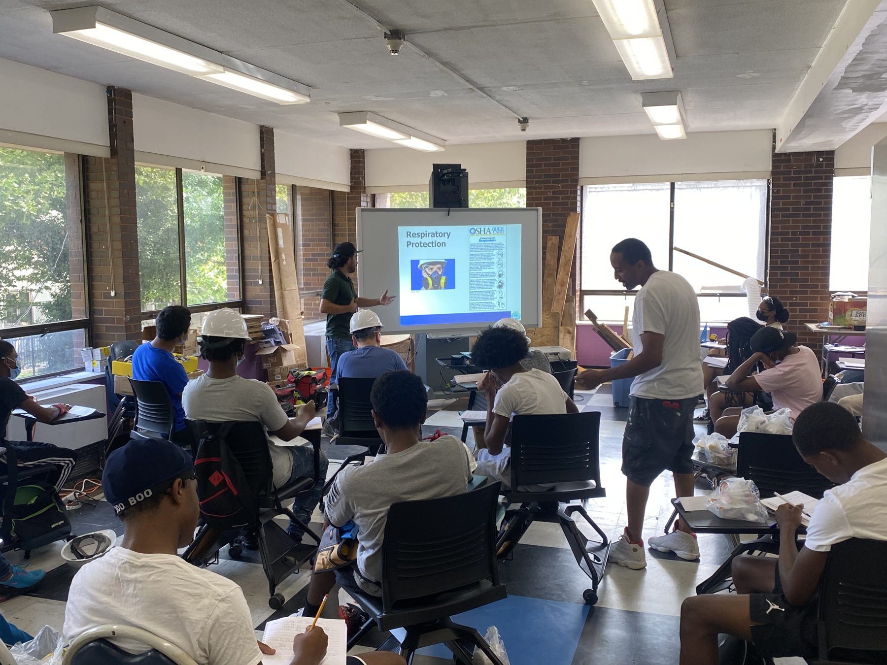 BTW cohort in hard hats during a jobsite safety classroom session