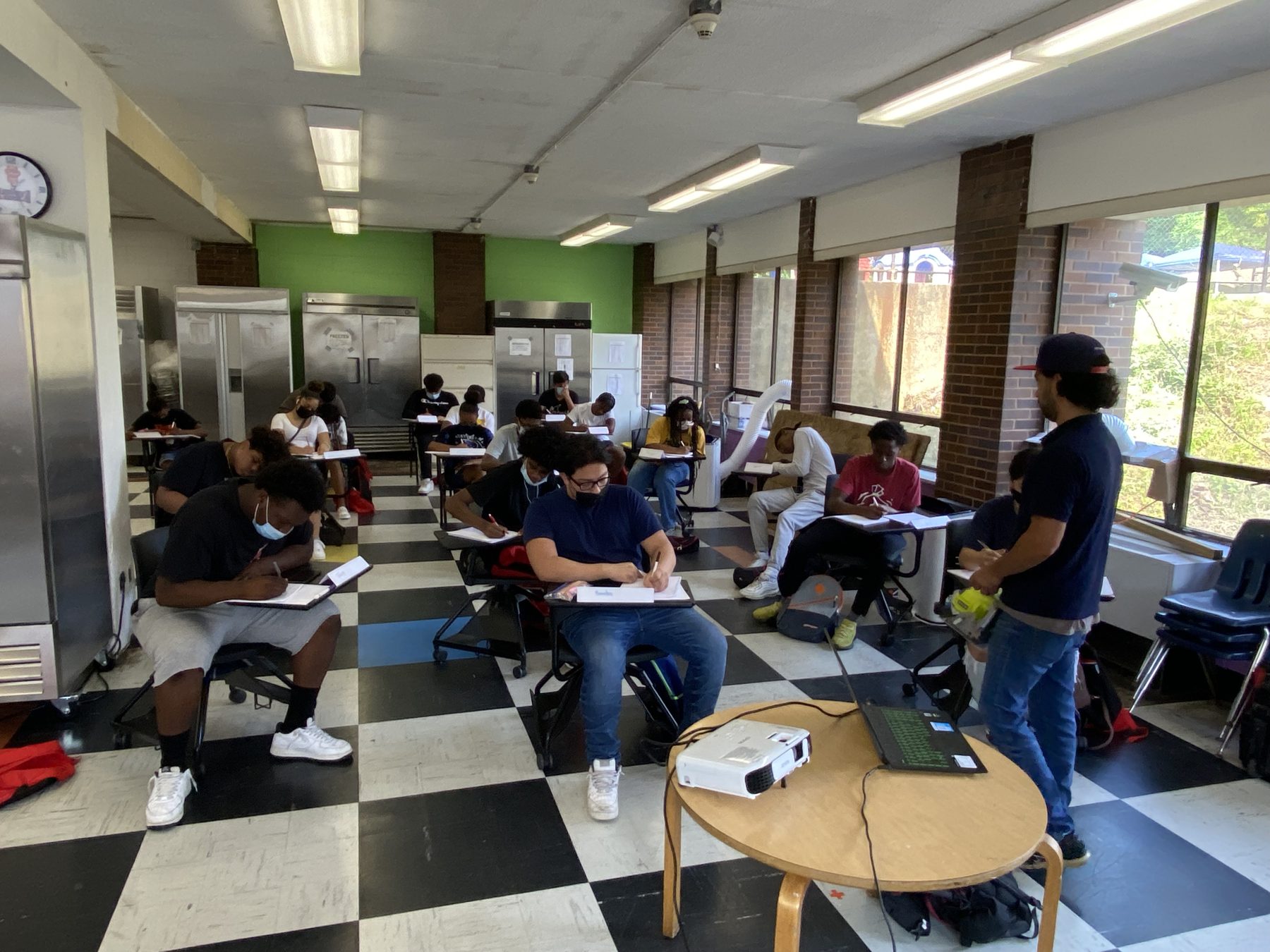 BTW participants seated in a workshop session with an instructor