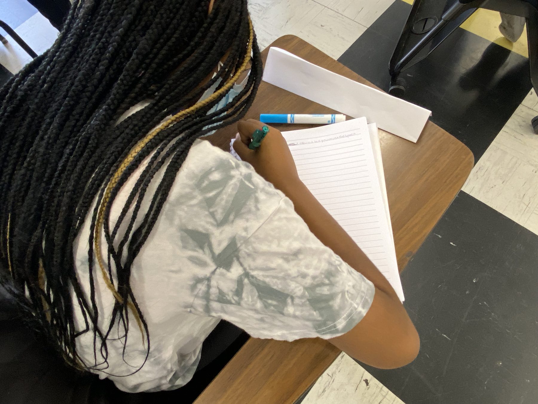 A BTW participant taking notes during instruction